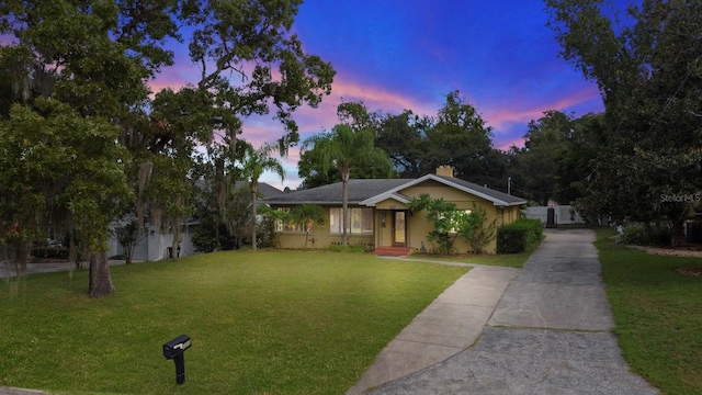 328 E Minnehaha Ave, Clermont, FL 34711 - view of front of property featuring driveway and a front lawn