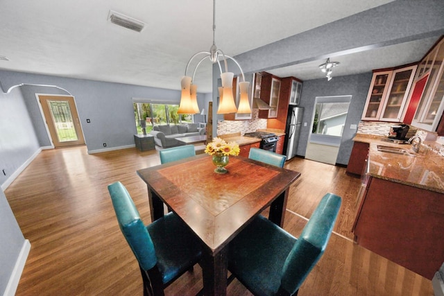328 E Minnehaha Ave, Clermont, FL 34711 - dining area with light wood-style floors and baseboards