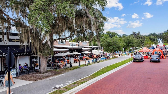 328 E Minnehaha Ave, Clermont, FL 34711 - view of asphalt road featuring sidewalks, street lighting, and curbs