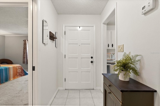 1126 Villa Ln Unit 91, Apopka, FL 32712 - doorway to outside with a textured ceiling and light tile patterned floors