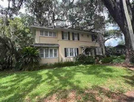 1854 Ingleside Ave, Jacksonville, FL 32205 - view of front facade with a front yard and stucco siding