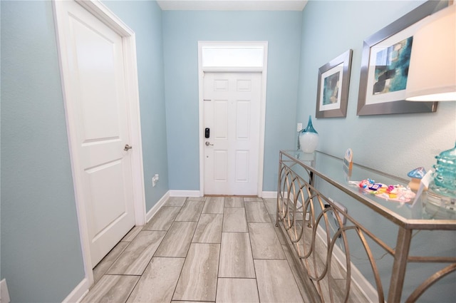 9014 Stinger Dr, Davenport, FL 33896 - entrance foyer with wood tiled floors and baseboards