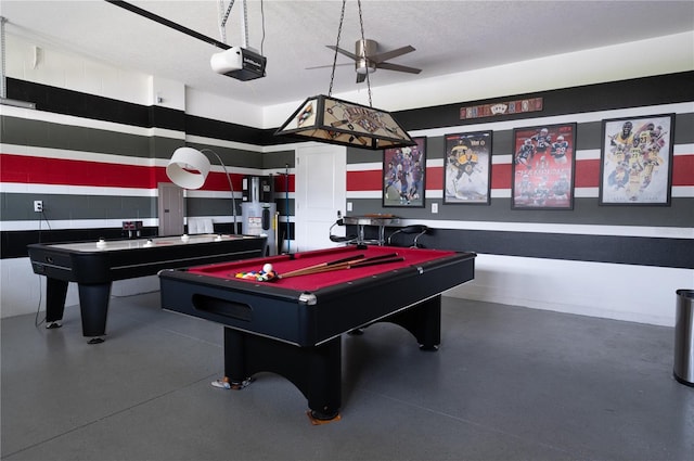 9014 Stinger Dr, Davenport, FL 33896 - recreation room featuring billiards, a textured ceiling, finished concrete flooring, water heater, and a ceiling fan