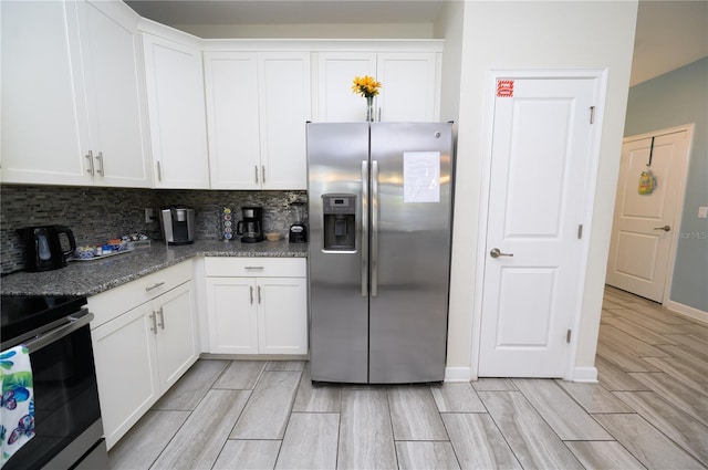 9014 Stinger Dr, Davenport, FL 33896 - kitchen with stainless steel appliances, wood tiled floors, tasteful backsplash, and white cabinetry