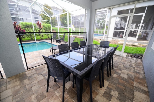 9014 Stinger Dr, Davenport, FL 33896 - sunroom / solarium featuring outdoor dining space