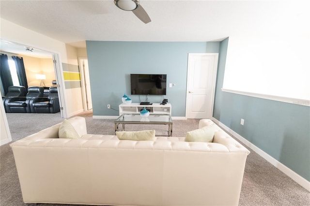 9014 Stinger Dr, Davenport, FL 33896 - carpeted living room with a ceiling fan and baseboards