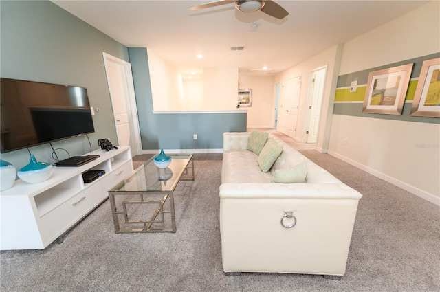 9014 Stinger Dr, Davenport, FL 33896 - carpeted living area featuring ceiling fan and baseboards