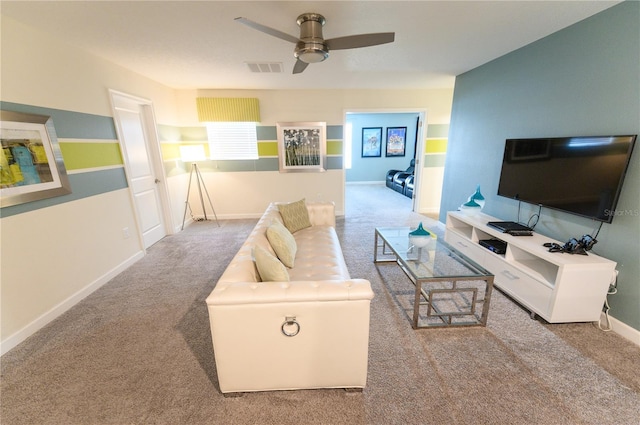 9014 Stinger Dr, Davenport, FL 33896 - carpeted living area with a ceiling fan and baseboards