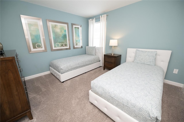 9014 Stinger Dr, Davenport, FL 33896 - bedroom with carpet flooring and baseboards