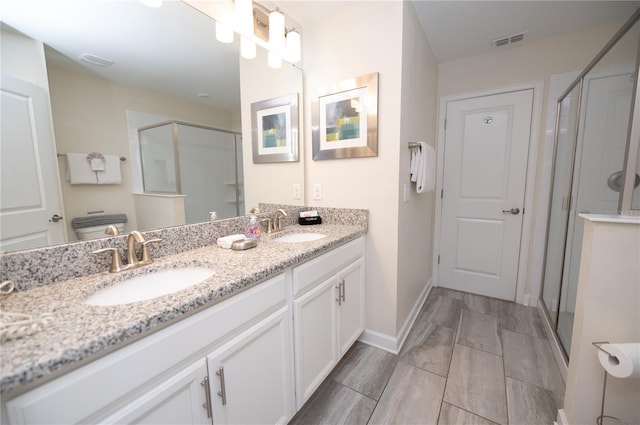 9014 Stinger Dr, Davenport, FL 33896 - full bathroom with double vanity and a stall shower
