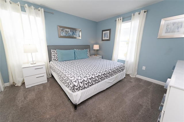 9014 Stinger Dr, Davenport, FL 33896 - bedroom featuring dark carpet and baseboards