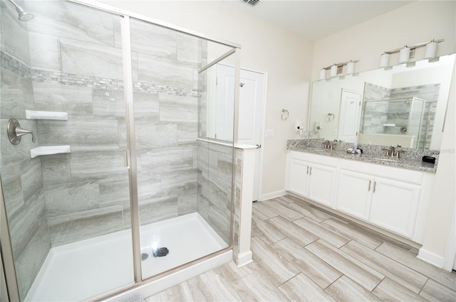 9014 Stinger Dr, Davenport, FL 33896 - full bath with a stall shower, double vanity, and wood finish floors