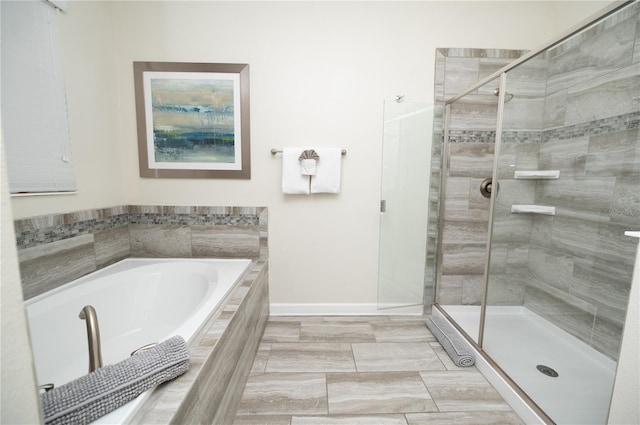 9014 Stinger Dr, Davenport, FL 33896 - bathroom featuring a garden tub and a shower stall