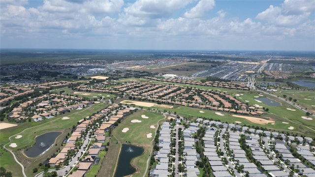 9014 Stinger Dr, Davenport, FL 33896 - aerial view of property and surrounding area featuring a nearby body of water, a golf course, and nearby suburban area