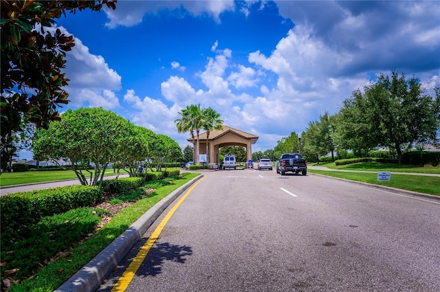 9014 Stinger Dr, Davenport, FL 33896 - view of asphalt street featuring curbs