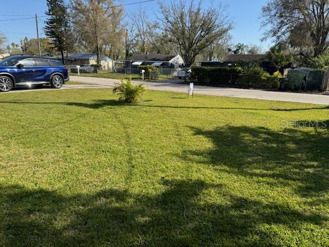 2847 W Harwood St Unit 0, Orlando, FL 32805 - view of grassy yard with driveway