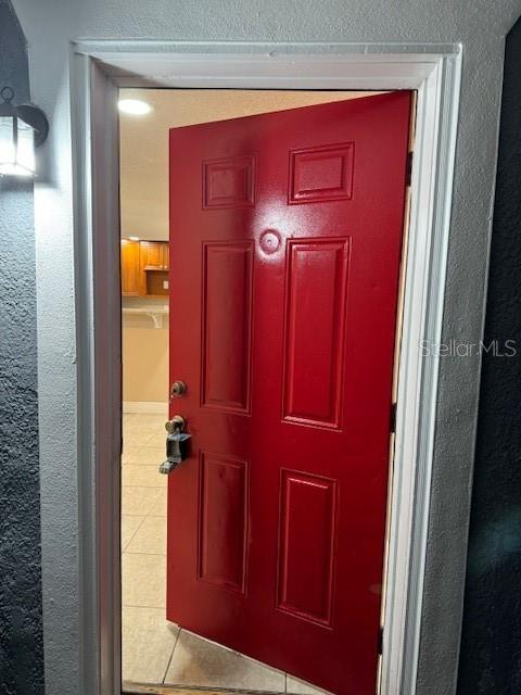 2847 W Harwood St Unit 0, Orlando, FL 32805 - doorway to property with stucco siding