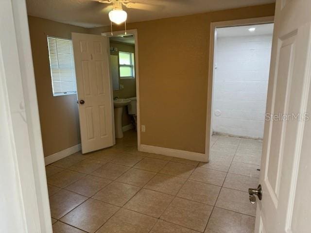 2847 W Harwood St Unit 0, Orlando, FL 32805 - unfurnished bedroom with light tile patterned floors and ceiling fan