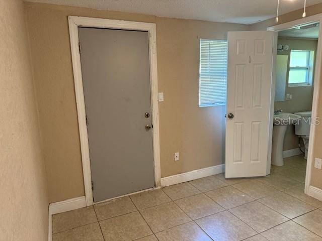 2847 W Harwood St Unit 0, Orlando, FL 32805 - entryway featuring light tile patterned floors and baseboards