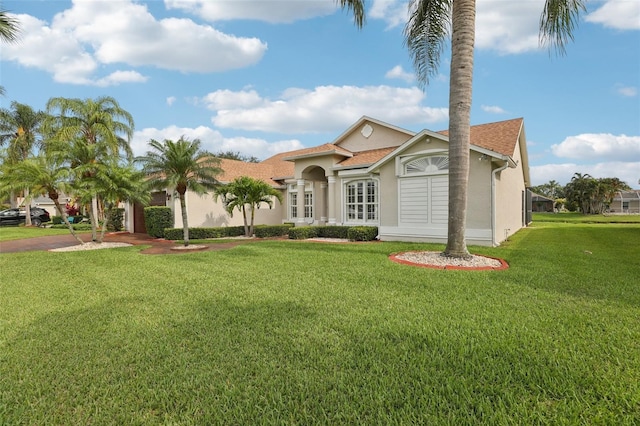 970 Sabal Grove Dr, Rockledge, FL 32955 - mediterranean / spanish house with stucco siding and a front yard