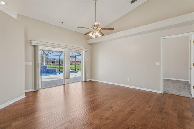 970 Sabal Grove Dr, Rockledge, FL 32955 - unfurnished room featuring a ceiling fan, wood finished floors, baseboards, and high vaulted ceiling