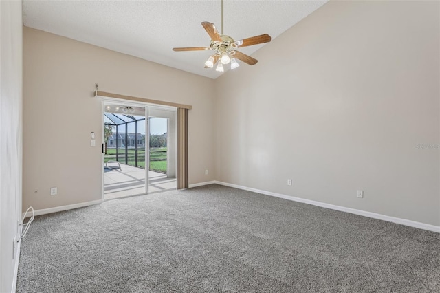 970 Sabal Grove Dr, Rockledge, FL 32955 - carpeted empty room featuring vaulted ceiling, ceiling fan, baseboards, and a textured ceiling