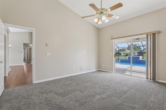 970 Sabal Grove Dr, Rockledge, FL 32955 - carpeted spare room with ceiling fan, high vaulted ceiling, baseboards, and wood finished floors