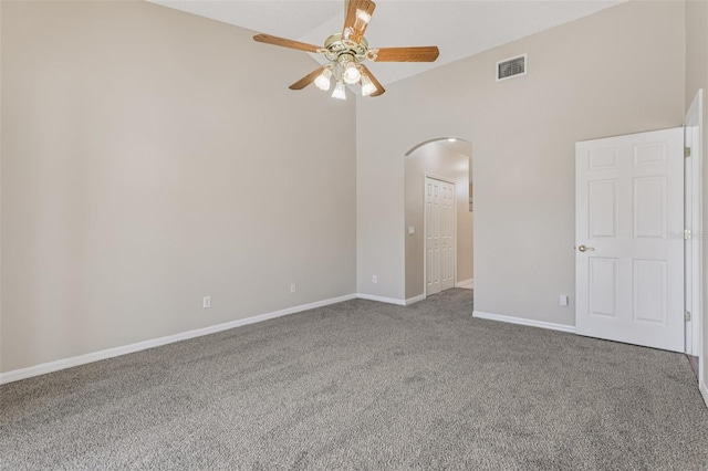 970 Sabal Grove Dr, Rockledge, FL 32955 - carpeted empty room with arched walkways, ceiling fan, baseboards, and high vaulted ceiling