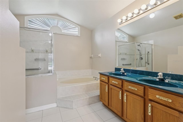 970 Sabal Grove Dr, Rockledge, FL 32955 - bathroom with a bath, tile patterned flooring, a shower stall, plenty of natural light, and lofted ceiling