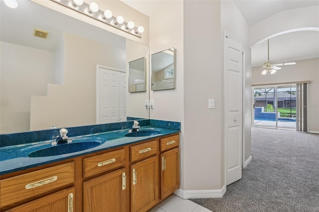 970 Sabal Grove Dr, Rockledge, FL 32955 - bathroom with double vanity, ceiling fan, baseboards, and tile patterned flooring