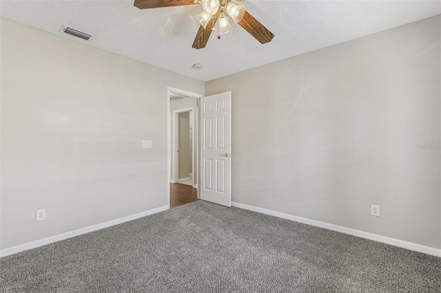 970 Sabal Grove Dr, Rockledge, FL 32955 - empty room with carpet, a ceiling fan, baseboards, and a textured ceiling