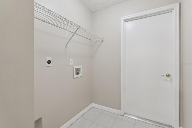 970 Sabal Grove Dr, Rockledge, FL 32955 - laundry room featuring electric dryer hookup, hookup for a washing machine, baseboards, and light tile patterned floors