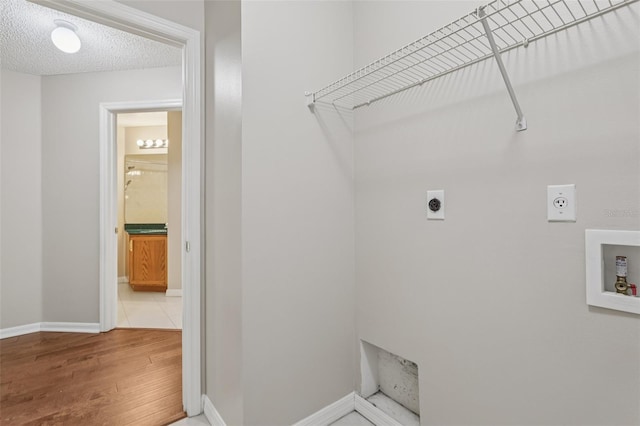 970 Sabal Grove Dr, Rockledge, FL 32955 - washroom with electric dryer hookup, washer hookup, wood finished floors, and baseboards