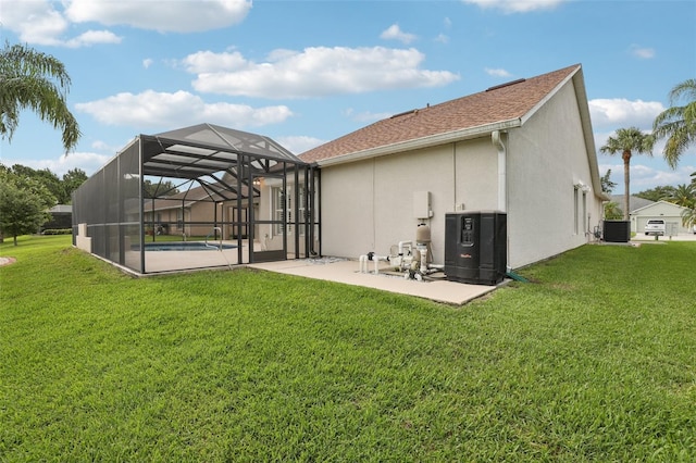 970 Sabal Grove Dr, Rockledge, FL 32955 - back of property with a patio area, central air condition unit, a lawn, and stucco siding