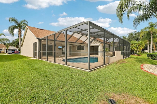 970 Sabal Grove Dr, Rockledge, FL 32955 - rear view of property featuring a yard, stucco siding, a patio, and an outdoor pool