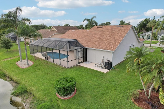 970 Sabal Grove Dr, Rockledge, FL 32955 - rear view of house featuring a patio area, stucco siding, an outdoor pool, a yard, and a lanai
