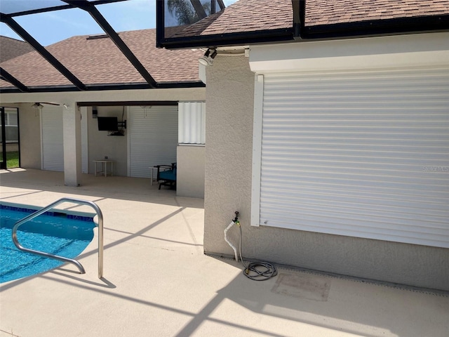 970 Sabal Grove Dr, Rockledge, FL 32955 - rear view of property with roof with shingles, a patio, a lanai, and an outdoor pool