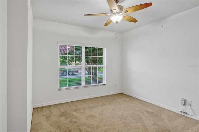 144 Williamson Dr, Davenport, FL 33897 - carpeted empty room with a ceiling fan and baseboards