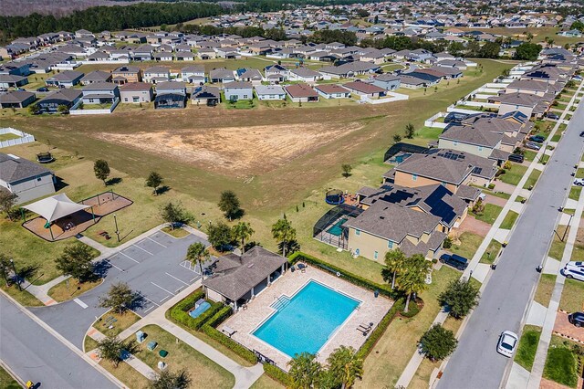 144 Williamson Dr, Davenport, FL 33897 - aerial overview of property's location featuring a pool and nearby suburban area