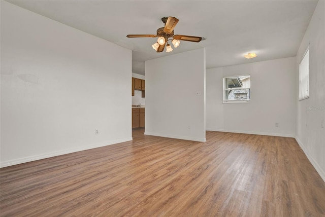 1170 E Bay St, Winter Garden, FL 34787 - spare room with light wood-type flooring, a ceiling fan, and baseboards
