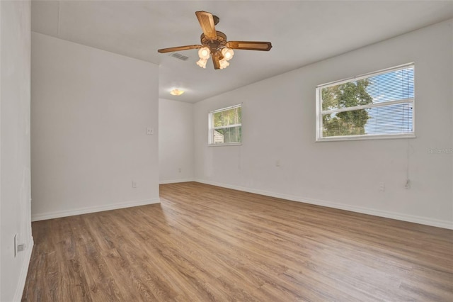 1170 E Bay St, Winter Garden, FL 34787 - empty room with light wood-style floors, baseboards, and a ceiling fan