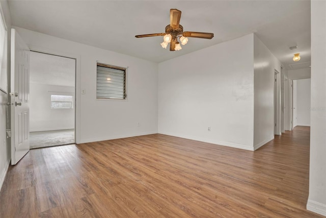 1170 E Bay St, Winter Garden, FL 34787 - spare room with light wood finished floors, ceiling fan, and baseboards