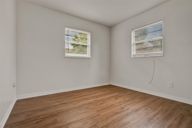 1170 E Bay St, Winter Garden, FL 34787 - empty room with wood finished floors and baseboards