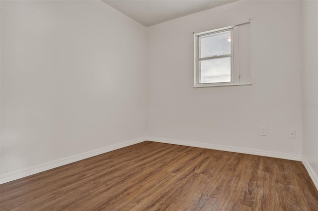 1170 E Bay St, Winter Garden, FL 34787 - empty room featuring wood finished floors and baseboards
