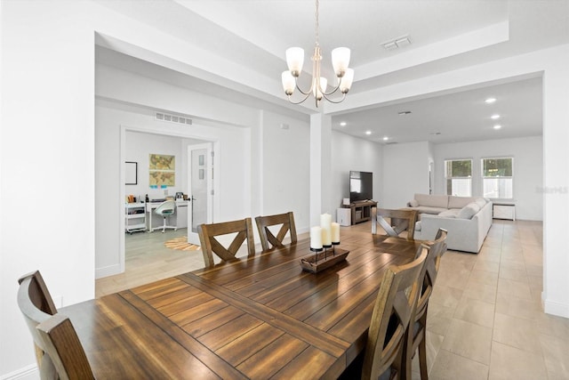 652 SW Mccoy Ave, Port St Lucie, FL 34953 - dining room featuring a chandelier, recessed lighting, a tray ceiling, a desk, and light tile patterned floors