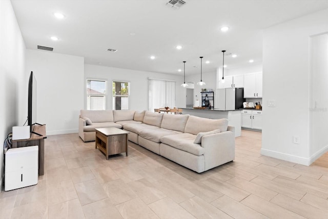 652 SW Mccoy Ave, Port St Lucie, FL 34953 - living area with recessed lighting and baseboards