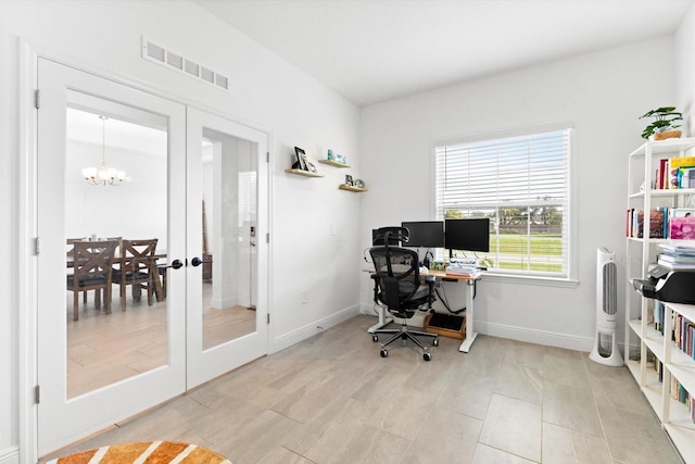652 SW Mccoy Ave, Port St Lucie, FL 34953 - office featuring a chandelier, french doors, baseboards, and light tile patterned floors