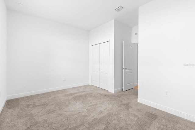 652 SW Mccoy Ave, Port St Lucie, FL 34953 - unfurnished bedroom with carpet flooring, baseboards, and a closet