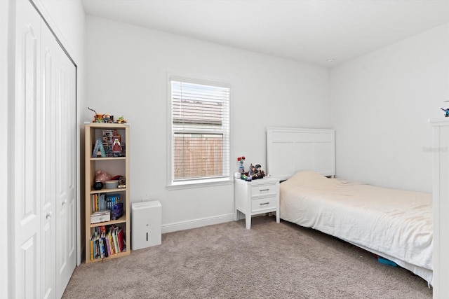 652 SW Mccoy Ave, Port St Lucie, FL 34953 - carpeted bedroom with a closet and baseboards