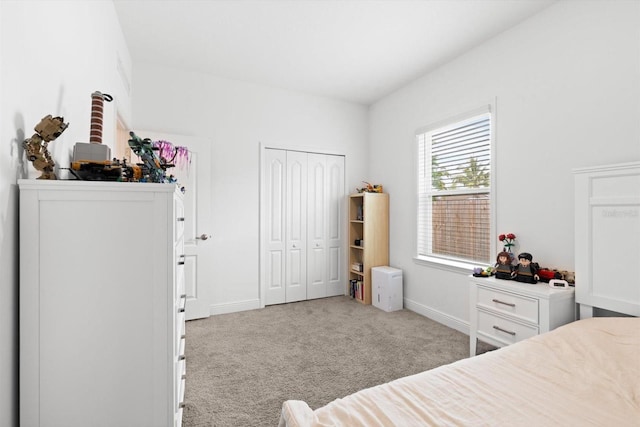652 SW Mccoy Ave, Port St Lucie, FL 34953 - bedroom with carpet floors, baseboards, and a closet